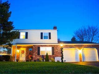 A view on a suburban house with a double garage door