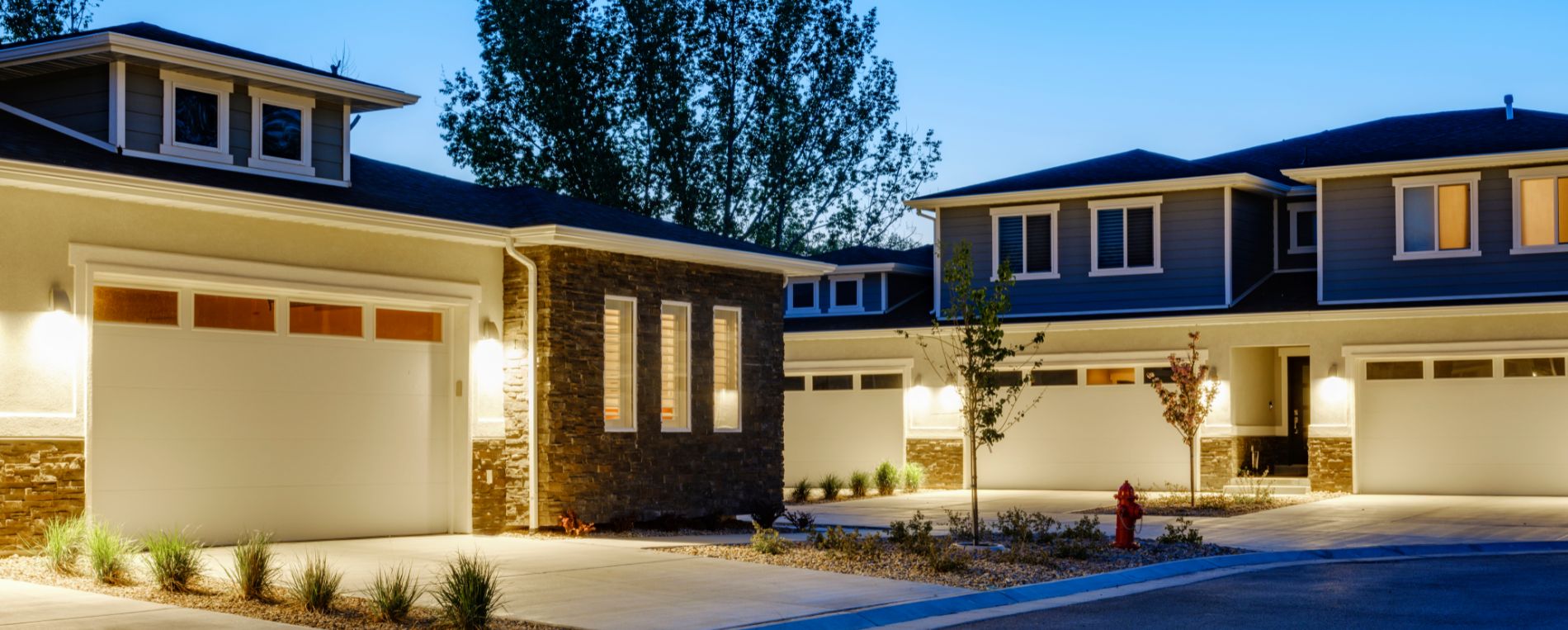 A view to suburb houses with garages at dusk